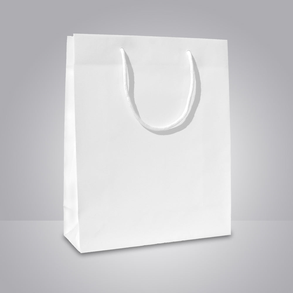 weiße papiertragetasche mit baumwollkordeln