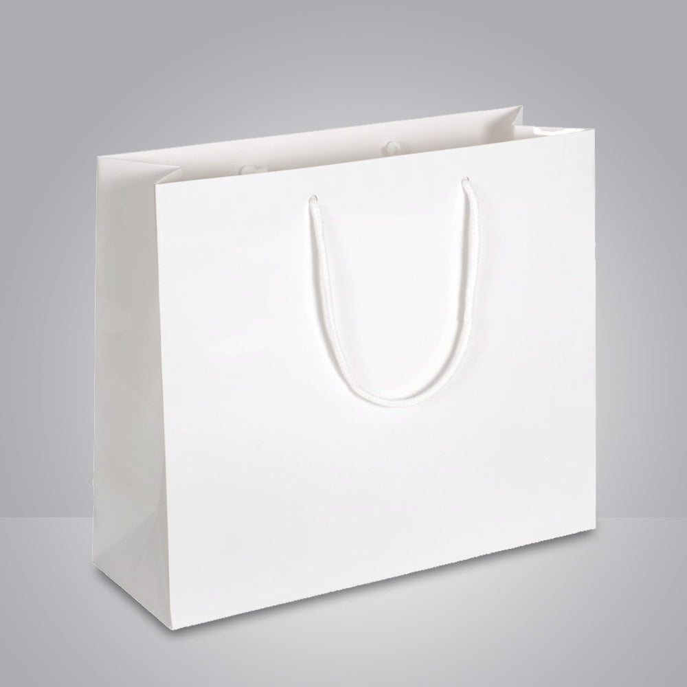 weiße papiertragetasche mit baumwollkordeln und glanzlamination